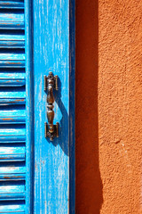 Blue window on Orange Wall