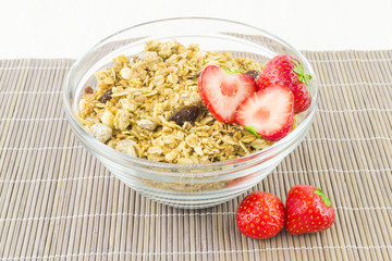 Cereal with strawberries on a mat