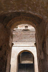 Fototapeta na wymiar Arch inside the Coliseum in Rome, Italy