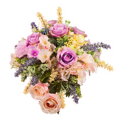 Bouquet from artificial flowers arrangement centerpiece in vase.