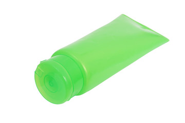 green plastic tube with closed  flip top lid on white background