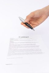 Hand offering pen for signature on contract