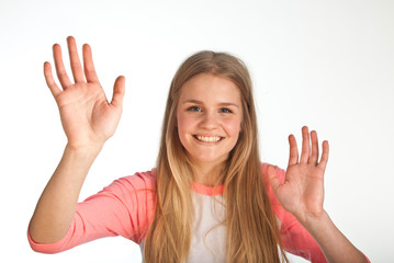 Scandinavian cute young girl waving with her hand