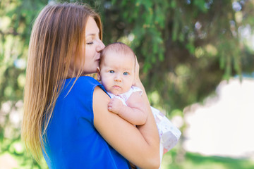 Beautiful mother and baby outdoor.