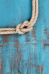 Fototapeta na wymiar Marine knot on wooden background