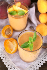 Apricot dessert in glasses on table close-up
