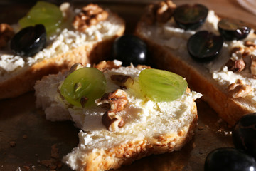 tasty bread with grape and cheese, close up