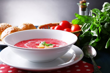 Gazpacho soup on color wooden background