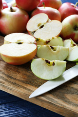 Juicy apples on wooden table, close-up