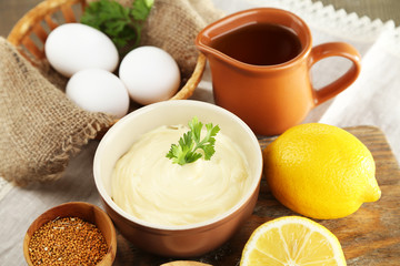 Mayonnaise ingredients on wooden background