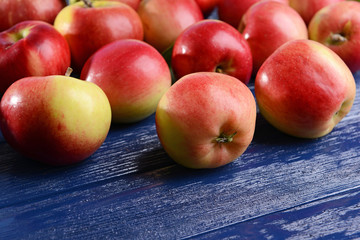 Sweet apples on wooden background