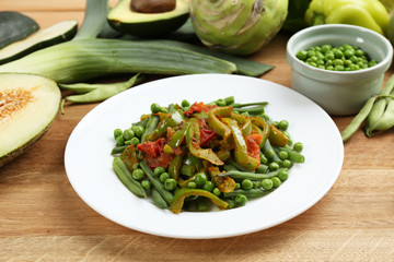 Healthy salad with peas, asparagus and pepper, close-up