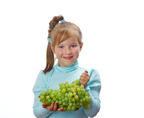 Small girl with grapes