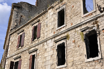 Fragments of partly destroyed building