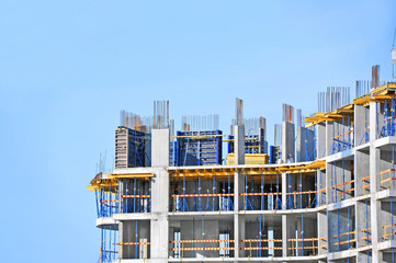 Building construction site work against blue sky