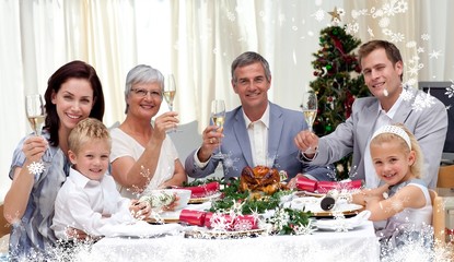 Family tusting in a christmas dinner with white wine