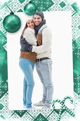 Attractive young couple in warm clothes hugging