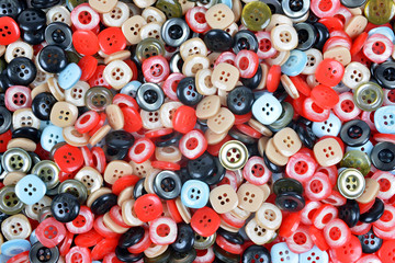 Fototapeta premium Closeup of a pile of buttons of many colors