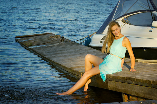 skinny girl on the river quay