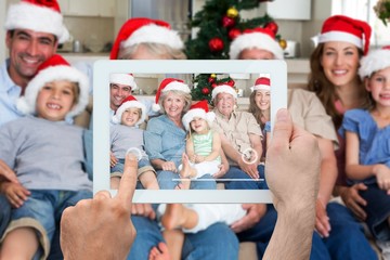 Fototapeta premium Composite image of hand holding tablet pc
