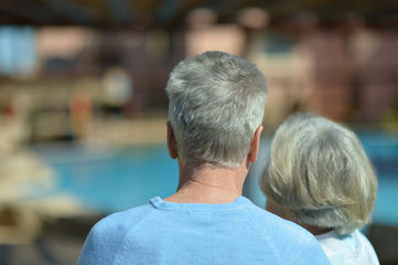 Elderly couple at pool