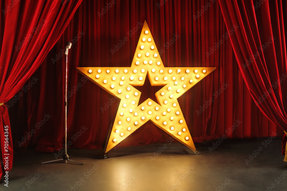 Wall mural scene with red curtains and big star with lights