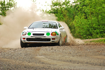 Obraz na płótnie Canvas Rally car in action - toytoa Celica GT4