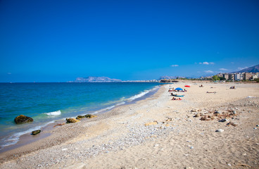 Sunny day on the pablic beach of Palermo. Sicily.