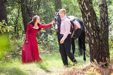 happy couple and horse