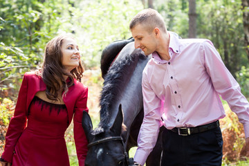 Fototapeta premium happy couple and horse