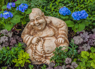 Terracotta figure of a Japanese god merry in the bush,