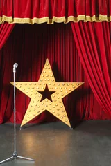 Stickers muraux Théâtre Beautiful big shining star and microphone on red stage