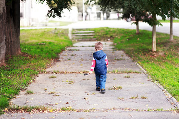 boy walking away