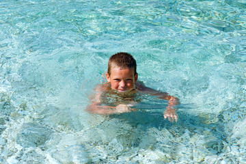 Boy bathing in the sea (Greece).