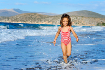 Toddler girl at beach