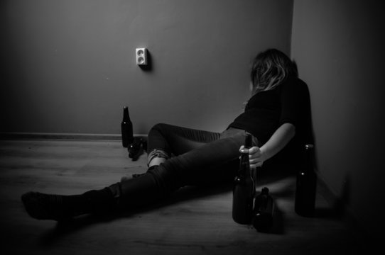sad woman drinking alcohol, black and white