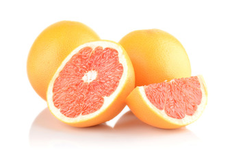 Studio shot sliced some grapefruits isolated white