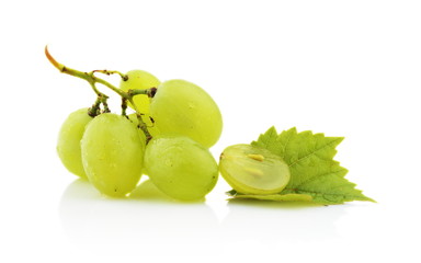Photo of some grapes with leaves isolated on white