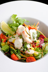 octopus salad with lemon slice lettuce and potatoes
