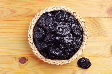 Dried plum in wicker bowl