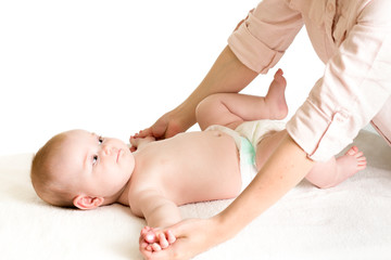 Obraz na płótnie Canvas mother massaging baby