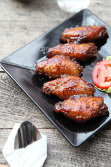 Fried chicken on wood background