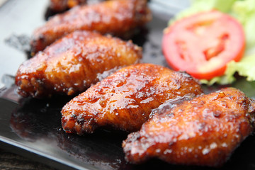 Fried chicken on wood background
