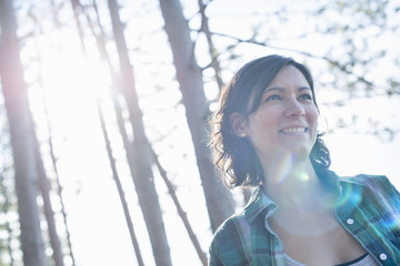 REMOVE 1220 DAVID HERON A woman walking through woodland in summer.