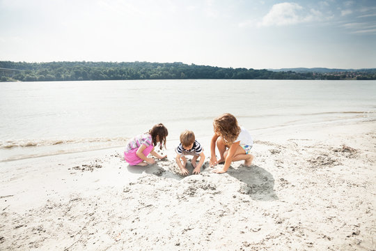 Small group of children playing on the beach