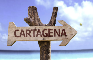 Cartagena wooden sign with a beach on background