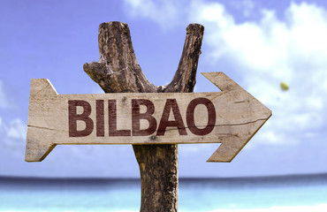 Bilbao wooden sign with a beach on background
