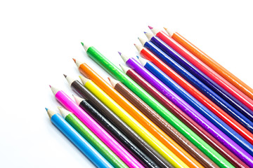Colored pencils on white background