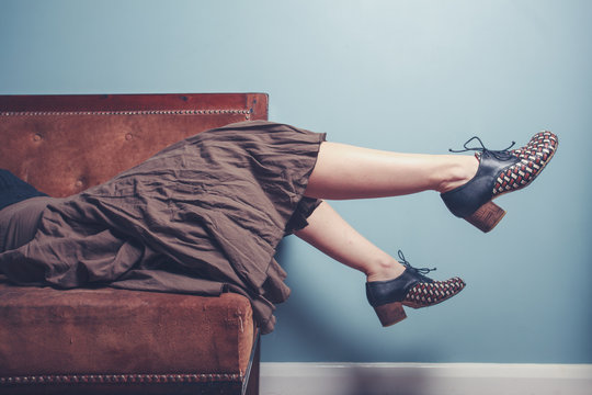 Young woman relaxing on sofa