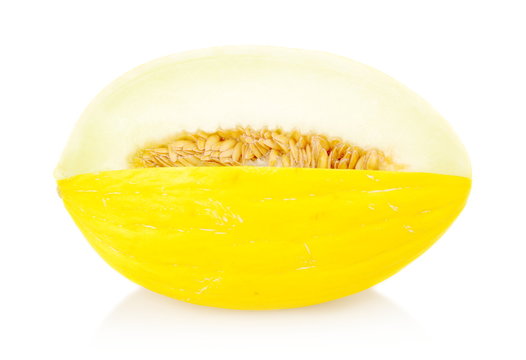 Whole yellow Canary melon isolated white in studio